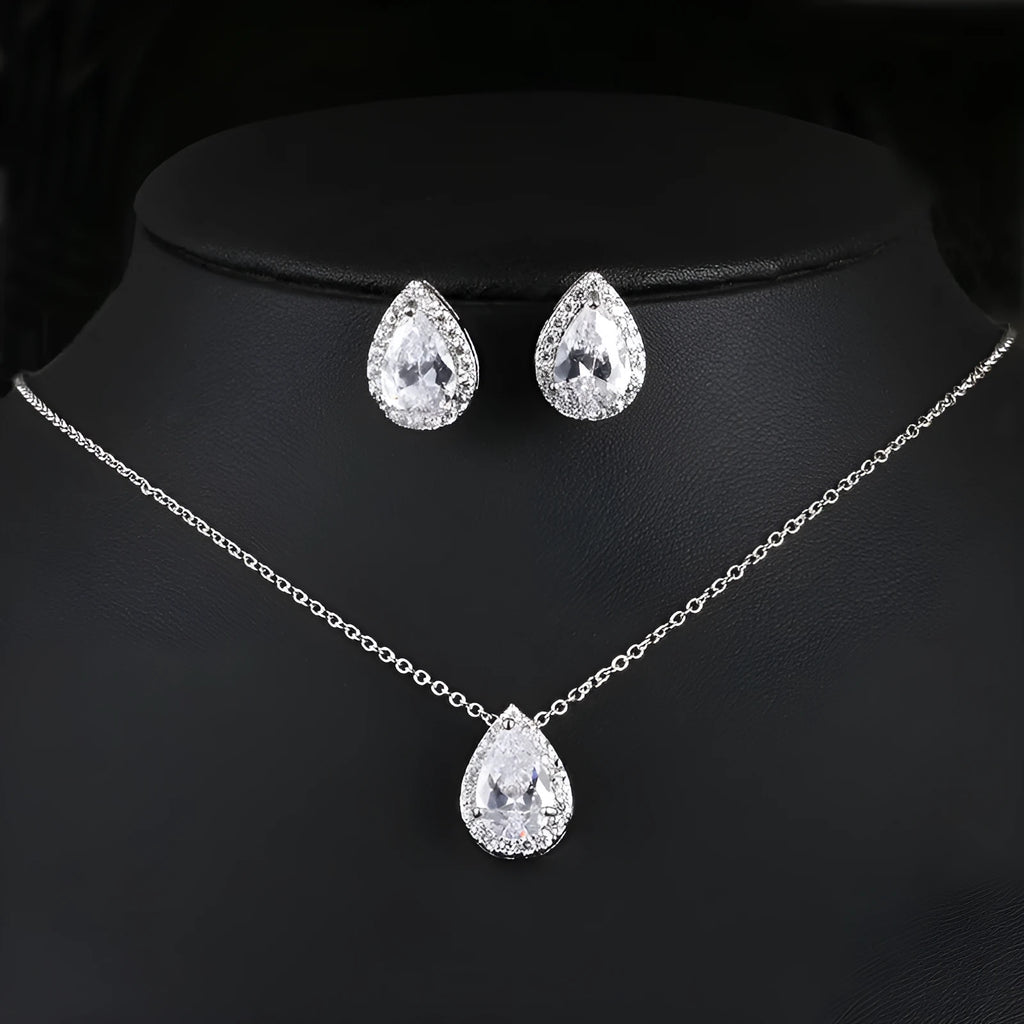 Women's water drop gemstone necklace and earrings set in copper with zircon on white background