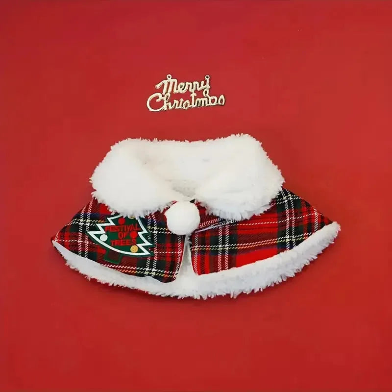 Red festive pet scarf with bell design on a dog, showing the polyester material and cloak-style fit.