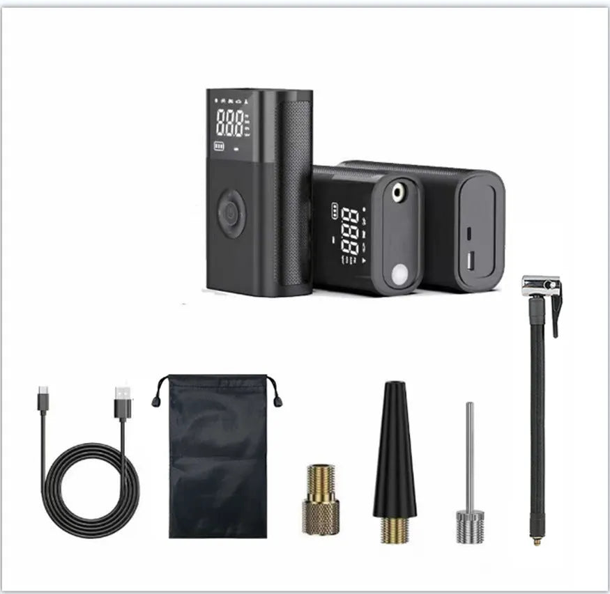 Black handheld wireless digital tyre inflator with LCD screen, LED light and multiple nozzle attachments on a table.