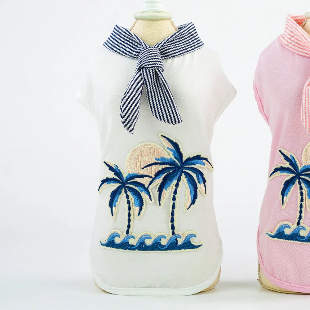 Pink cotton dog coat with coconut tree embroidery on a white background, size M shown