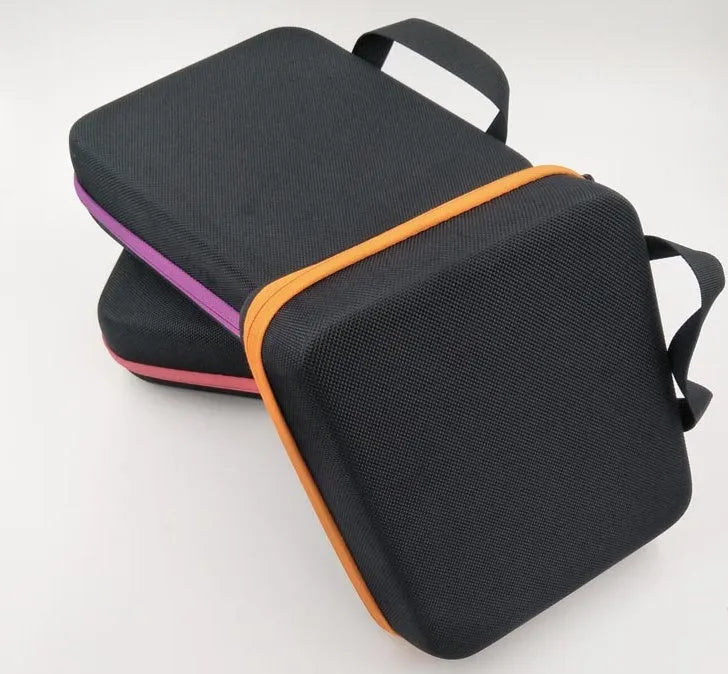 Red EVA cube-shaped essential oil storage bag with 30 compartments and a zipper, shown wall-mounted.