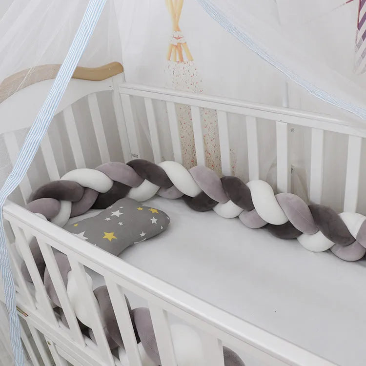 Spandex crystal velvet baby cot bumper in grey pink colour, shown flexible and long.