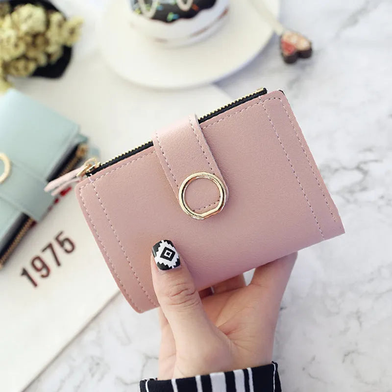 Buckle ring women's wallet in PU leather, 12 x 9 cm, shown in one of seven colours