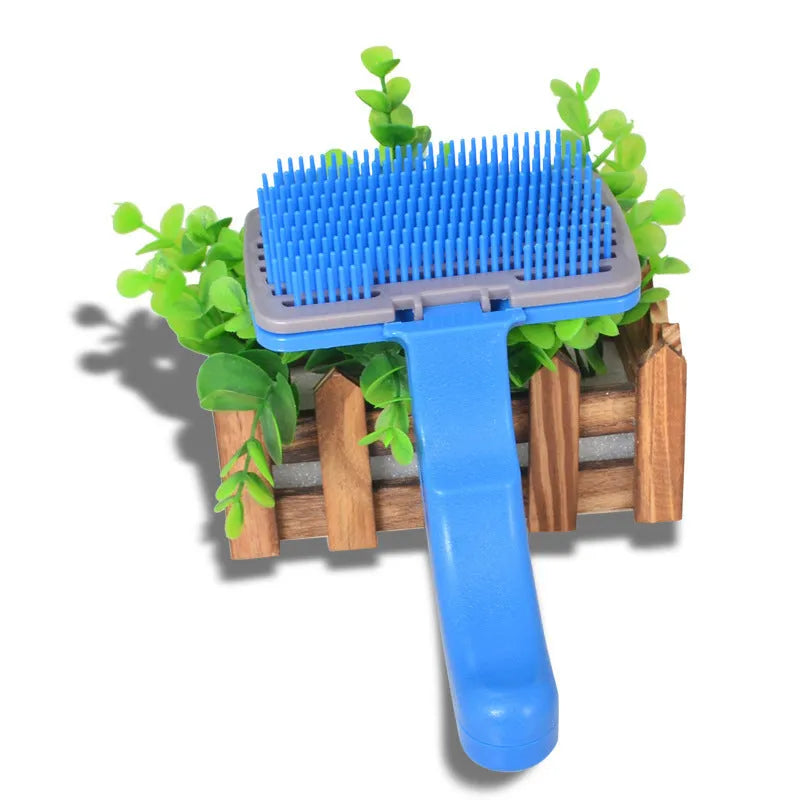Self-cleaning pet brush comb for dogs and cats measuring 16 x 10cm with comfortable handle