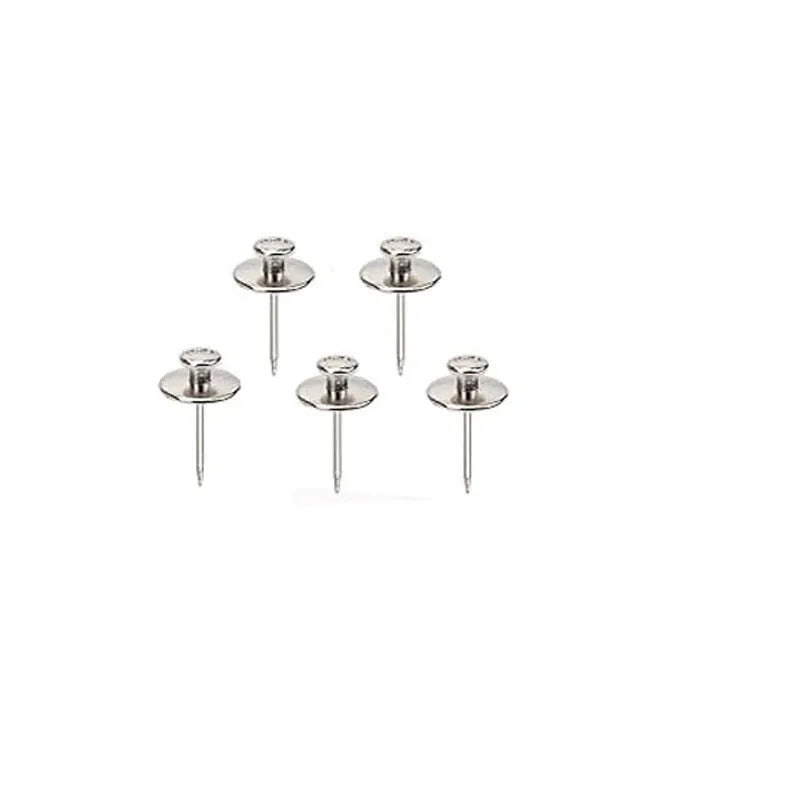 Fancy thumb tack set in mixed colours black gold silver bronze on a corkboard surface