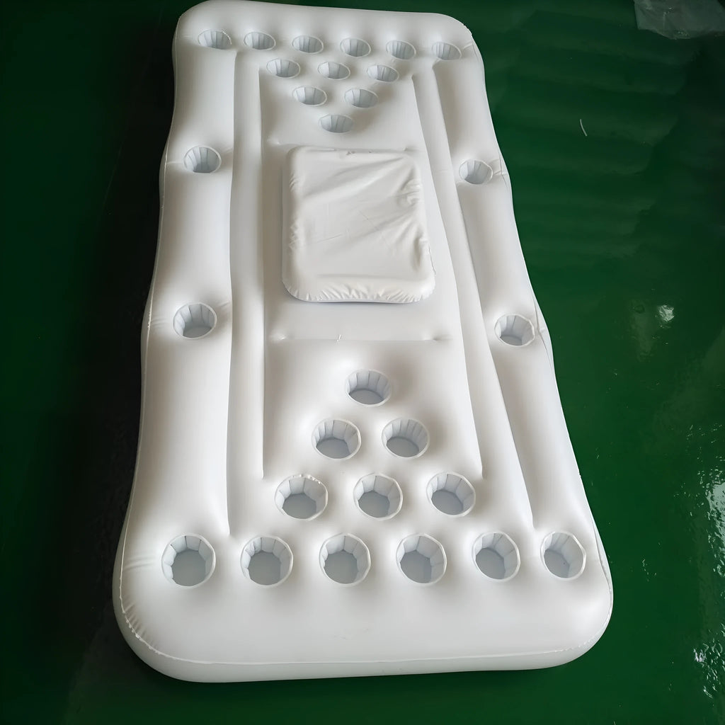 Inflatable beer pong buoy floating on pool water with cups set up on 24-hole blue surface