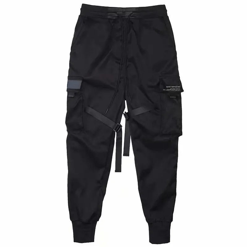 Men's black cotton cargo joggers with drawstring waist and side velcro pockets, loose harem fit