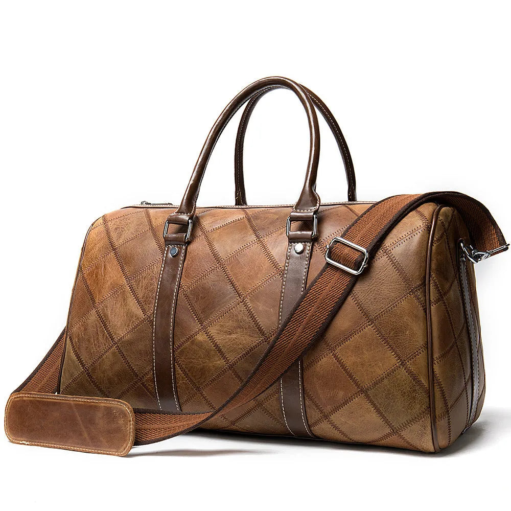 Vintage brown leather men's duffel bag with a single shoulder strap shown open to reveal internal organiser pockets.