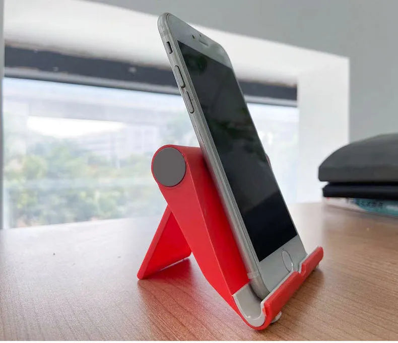 Black PE folding tablet stand holding mobile phone at adjustable angle