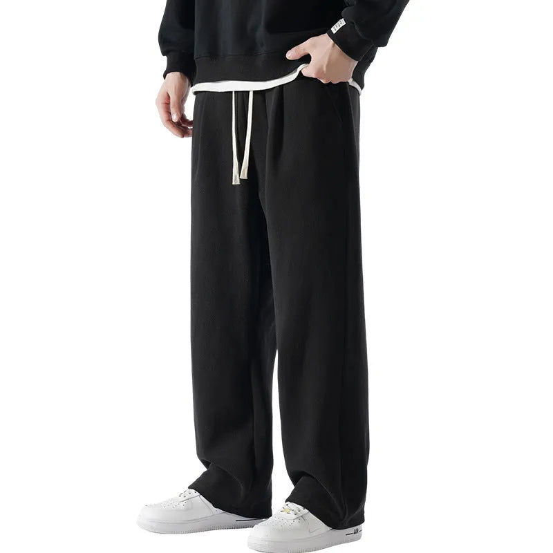 Men's apricot coloured double-sided polar fleece winter pants with a loose fit and drawstring waist.