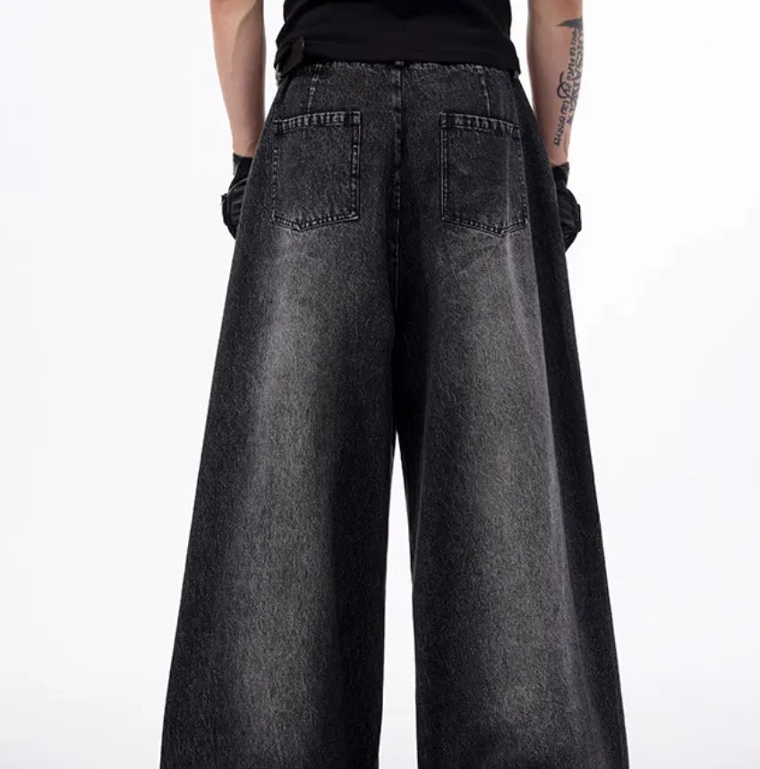Black and grey washed denim wide leg trousers and vest set on a hanger