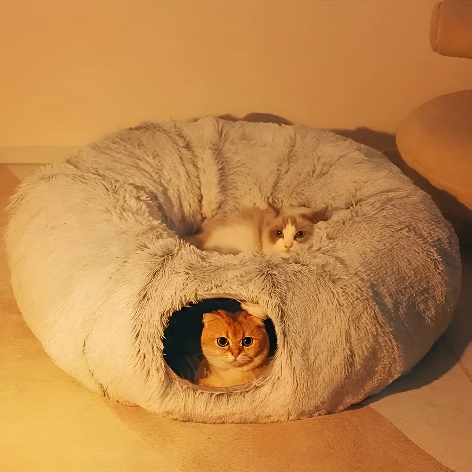 Gray plush cat bed mat measuring 85 by 85 by 26 centimetres, placed on floor for winter use