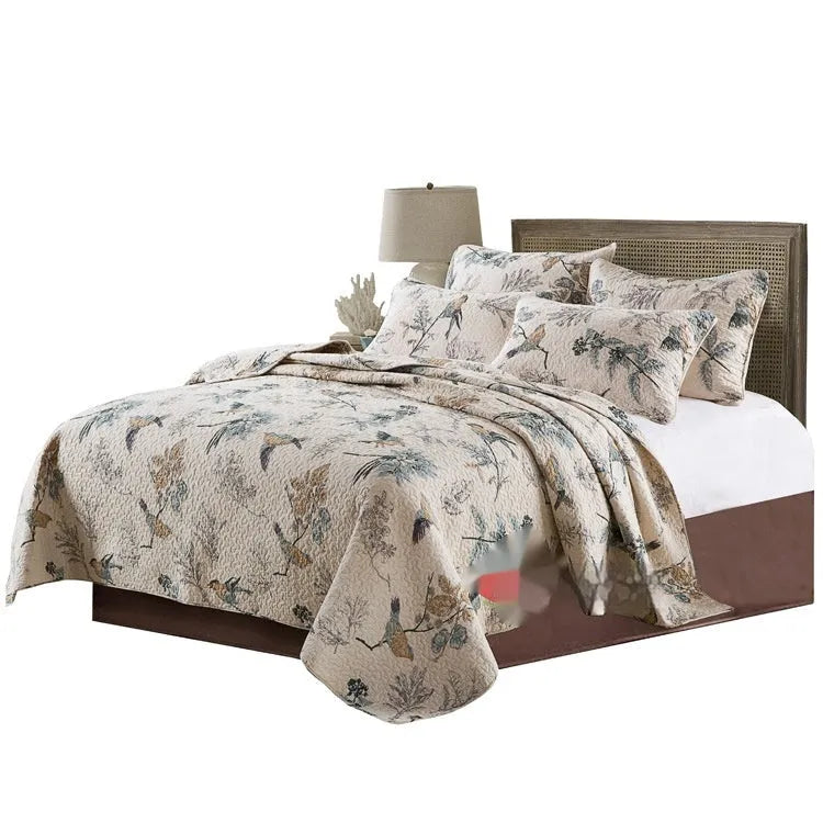 Quilted pure cotton bed cover set with printed pattern on bed, includes two pillowcases.