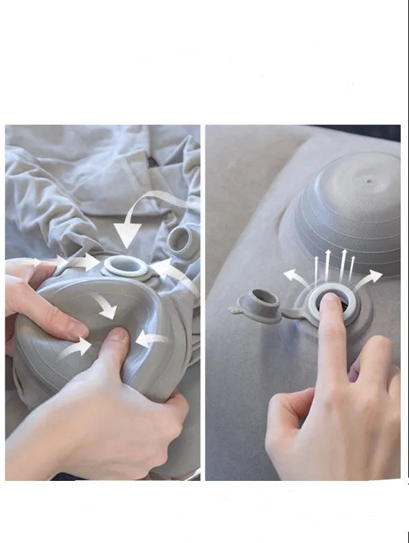 Inflatable foot pad in gray with push-on inflation mechanism and three-layer storage bag for travel and office use