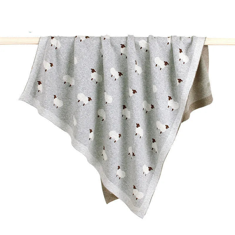 A pink 100x80 cm cotton baby blanket cover laid flat, designed to be windproof for infant cots.