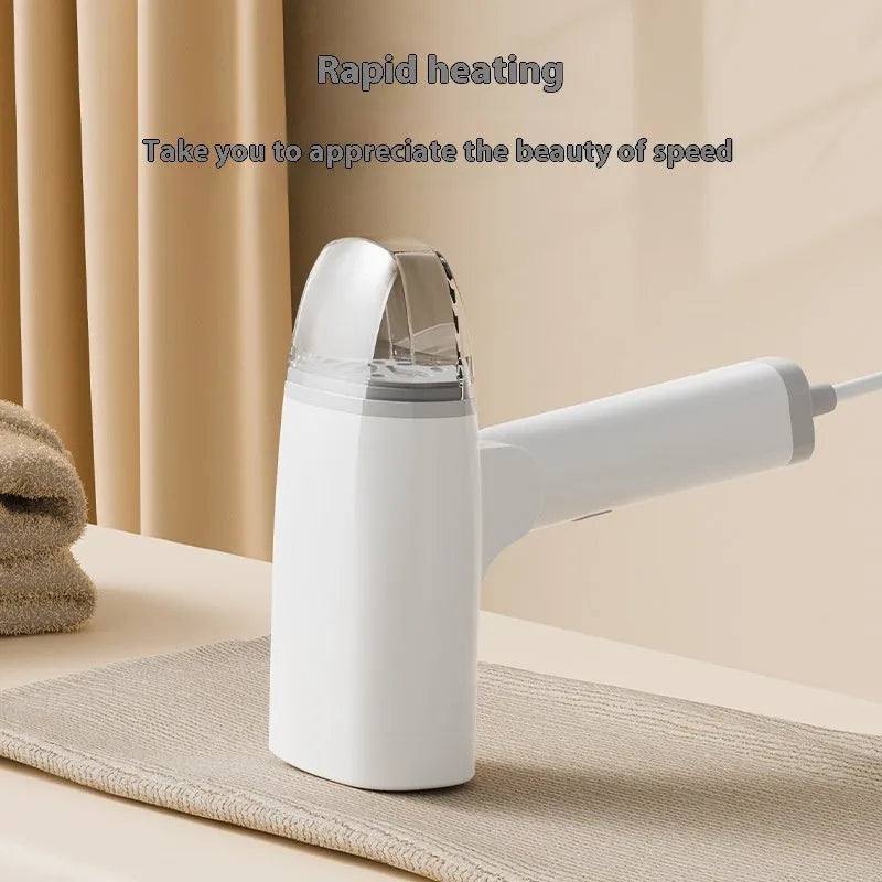 Blue handheld garment steamer with water tank and temperature control dial