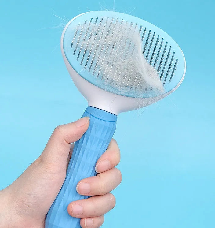 Self-cleaning pet comb with fine needle stainless steel teeth, rubber body, 19 cm, in blue, pink, or grey