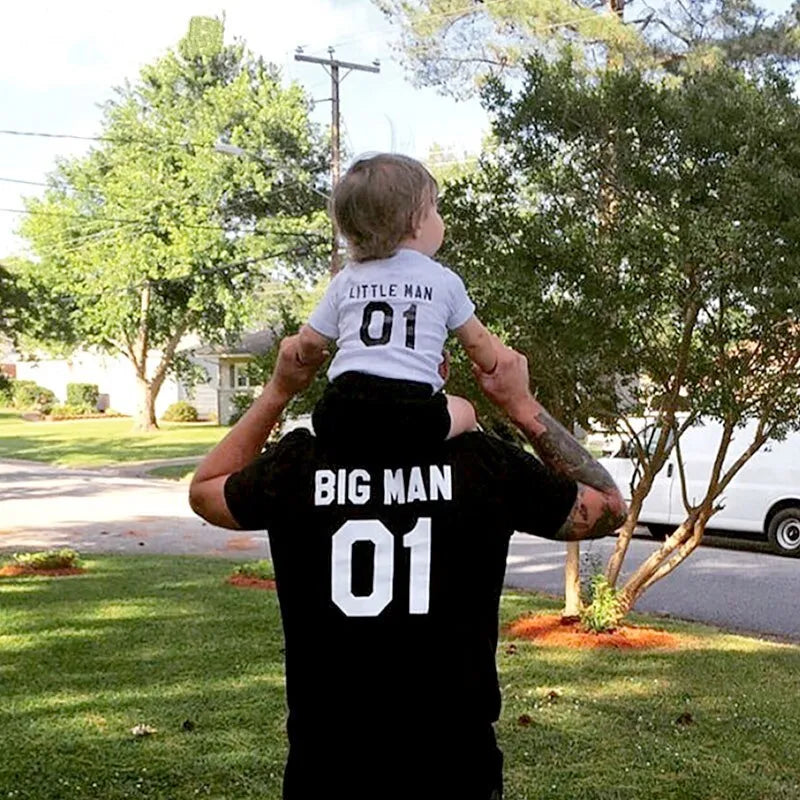 Parent and child wearing matching solid colour cotton T-shirts in black and white