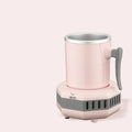 White mini quick cooling cup with aluminium drinking vessel and electronic base on a desk.