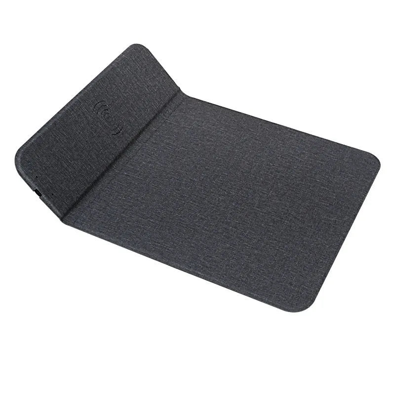 Grey foldable cloth phone holder with wireless charging stand on a desk