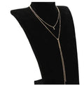 Multilayer lariat necklace in gold alloy plating with two layered strands and extension chain on white background
