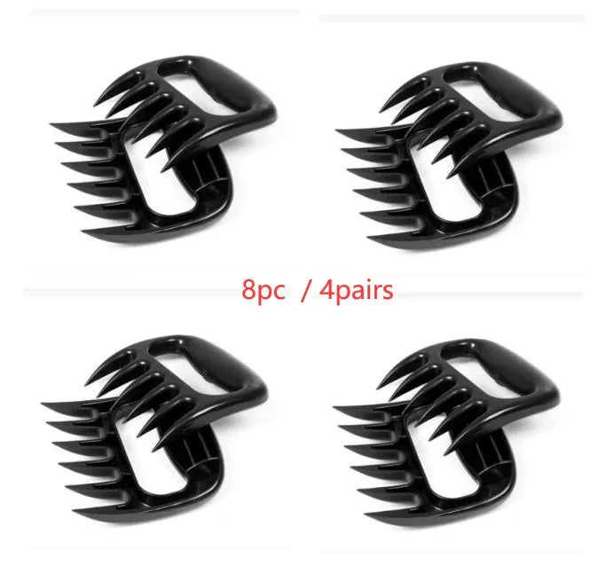 Two black bear claw design meat shredder forks with decorative patterns