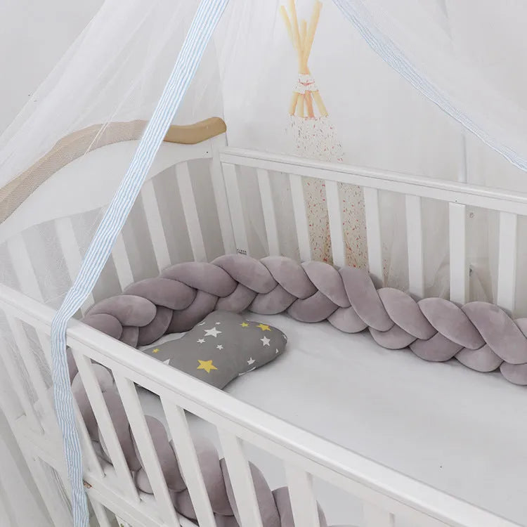 Spandex crystal velvet baby cot bumper in grey pink colour, shown flexible and long.