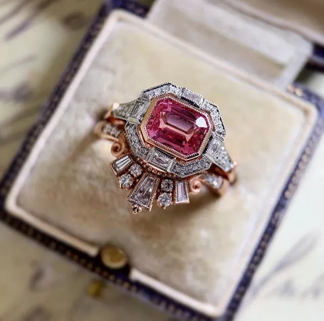 Rose gold coloured geometric alloy women's ring with a retro style on a finger.