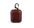 Genuine leather protective case for Apple Airpods charging box in black, brown, light brown, and red.