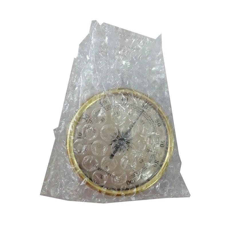 Analogue thermometer and hygrometer with aluminium ring and dial showing temperature and humidity scales.