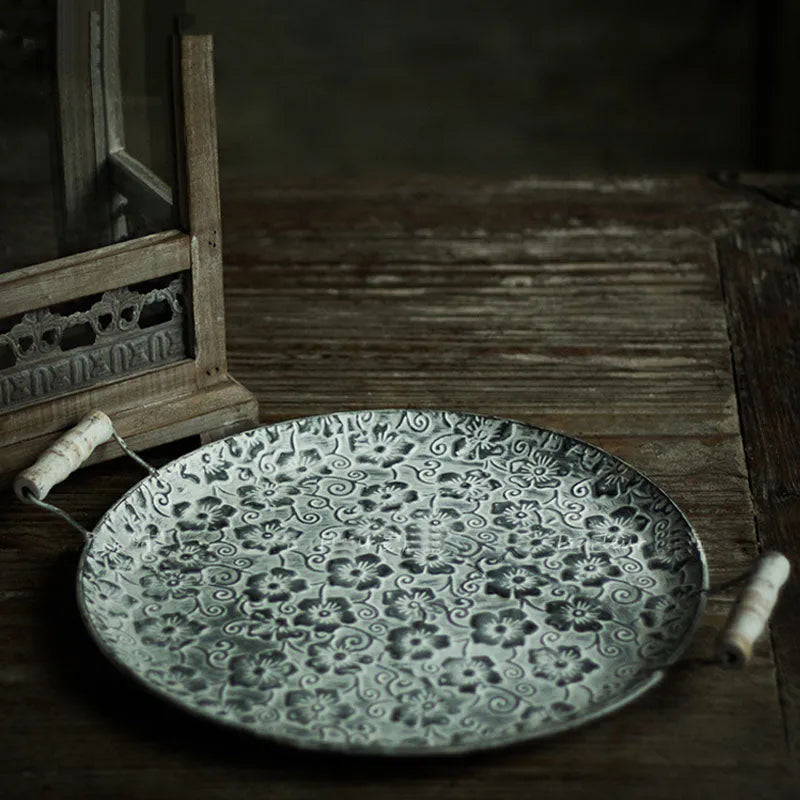 Round wrought iron storage tray in two sizes for organising jewellery or food on a countertop.