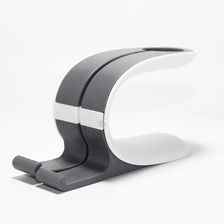 Grey charging stand holding Apple mobile phone and watch for simultaneous desktop charging