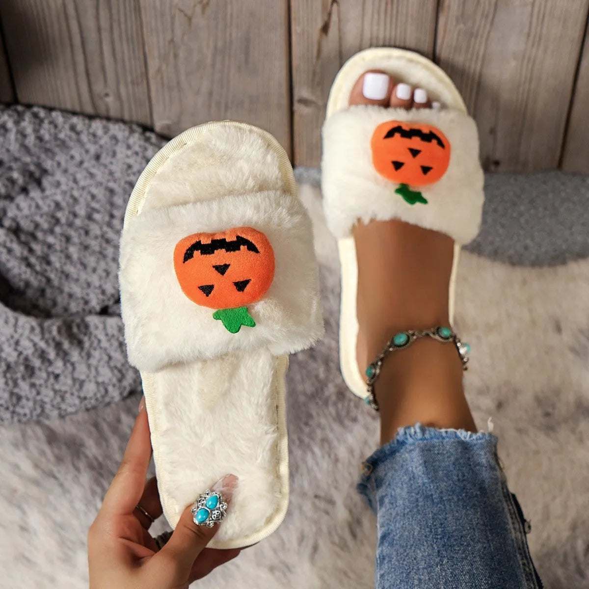 Women's white and yellow pumpkin cartoon plush open toe slippers on anti-slip PVC sole.