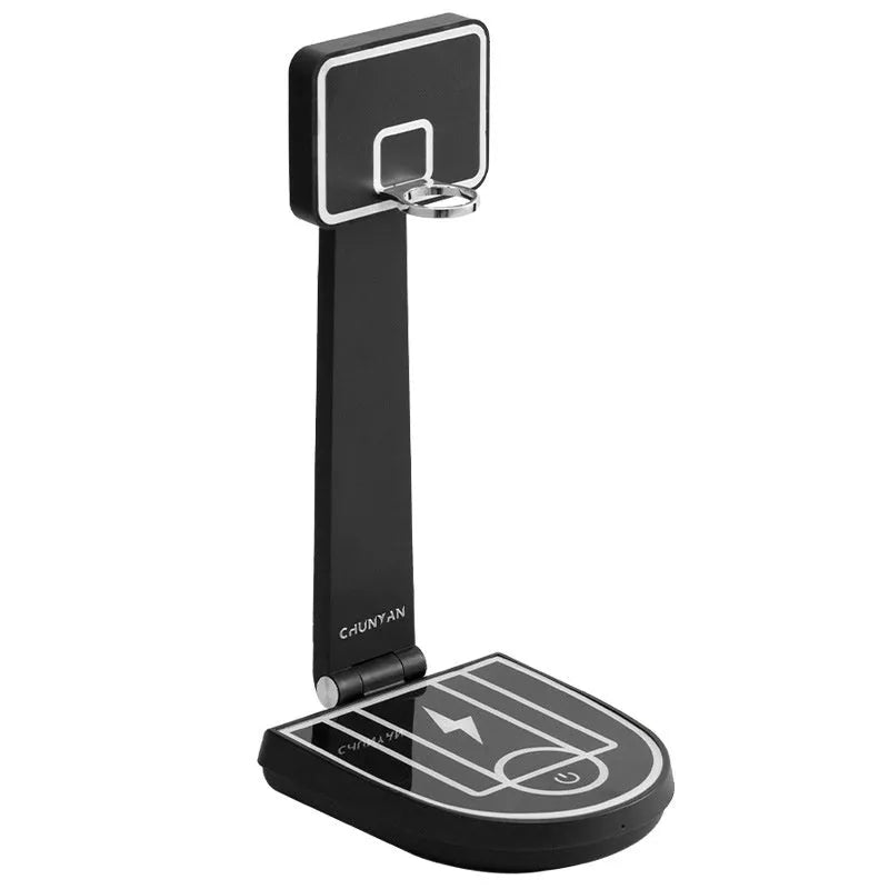 Creative basketball stand table lamp with 15W wireless charging touch, black finish, on a desk with a phone charging