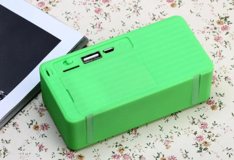 Cannon X3 portable wireless Bluetooth speaker mini cube in black, blue, green, red, or yellow.