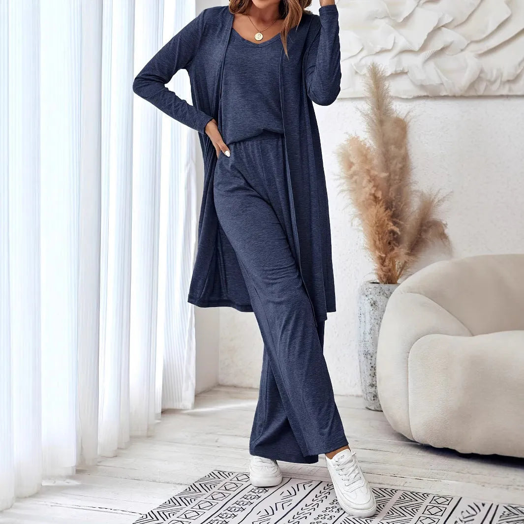 Blue women's three-piece casual suit with sling top, long cardigan, and trousers on a hanger.