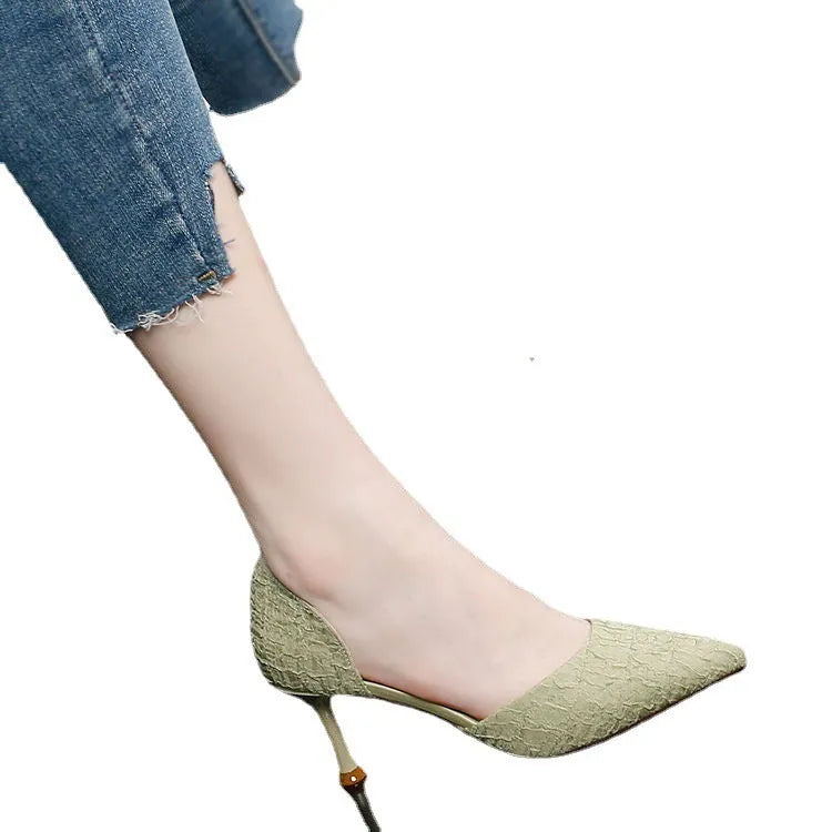 Women's black pointed toe stiletto high heels with a 6-8cm heel on a rubber sole.