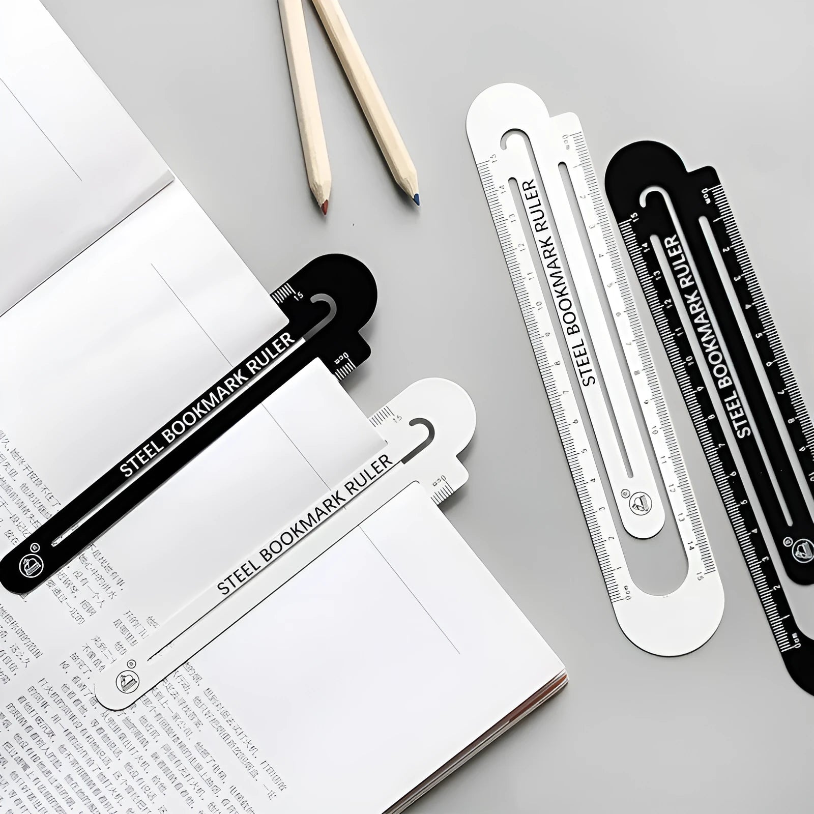 Black and white two-sided 12cm steel ruler on a wooden desk.