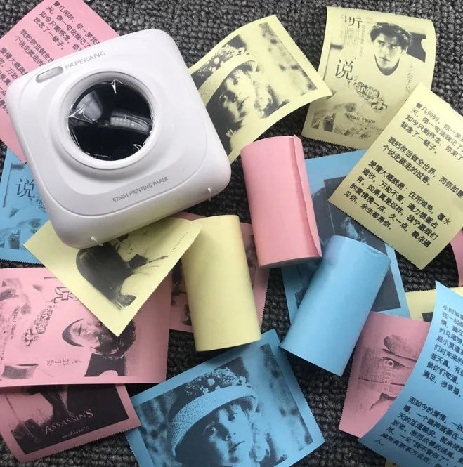 Mini Bluetooth wireless thermal printer in white, pink, and blue, 79x42x79mm, for printing photos from smartphone