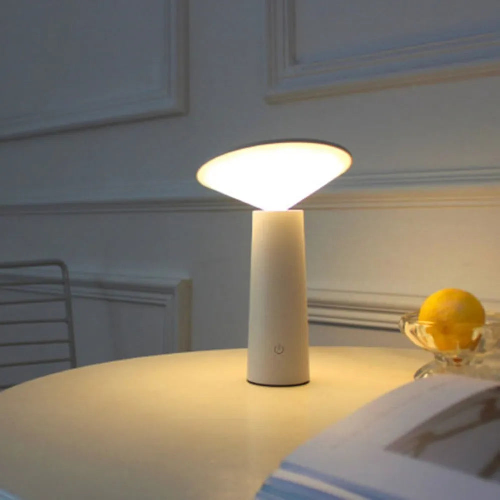 Black USB LED table lamp with touch controls and adjustable 40-degree flip head on wooden desk