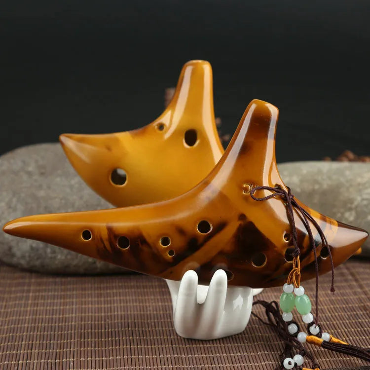 Yellow 12-hole ceramic ocarina in Alto C with 13-note C major range, integrated lanyard, bag and cable