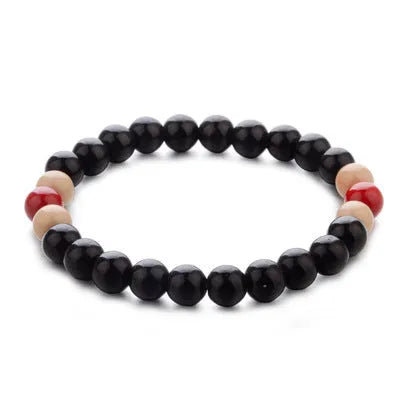 Natural lava stone bead bracelet with ethnic style design on wrist