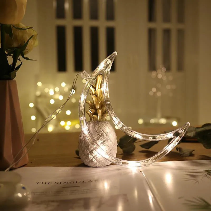 Battery-powered Christmas LED chandelier light with suction cups, showing Santa Claus design.