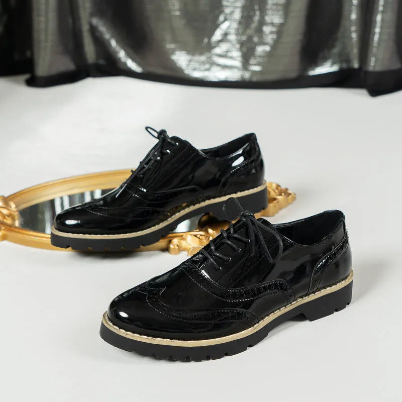 Women's black loafers with wedge heel and lace-up design, sequin detailing on round toe