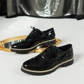 Women's black loafers with wedge heel and lace-up design, sequin detailing on round toe