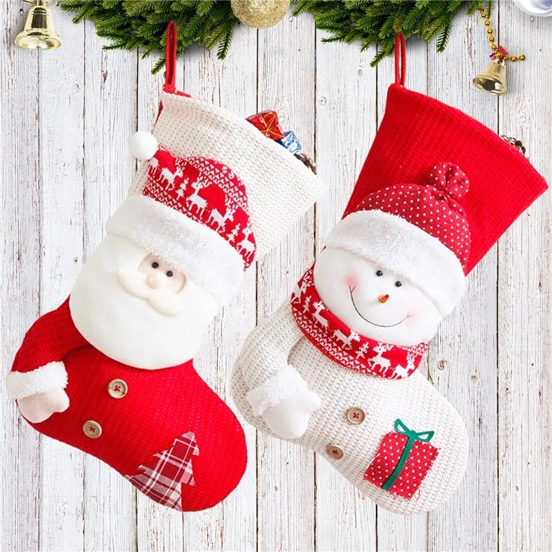 Large red and white knitted Christmas stocking with Santa Claus design hanging on fireplace