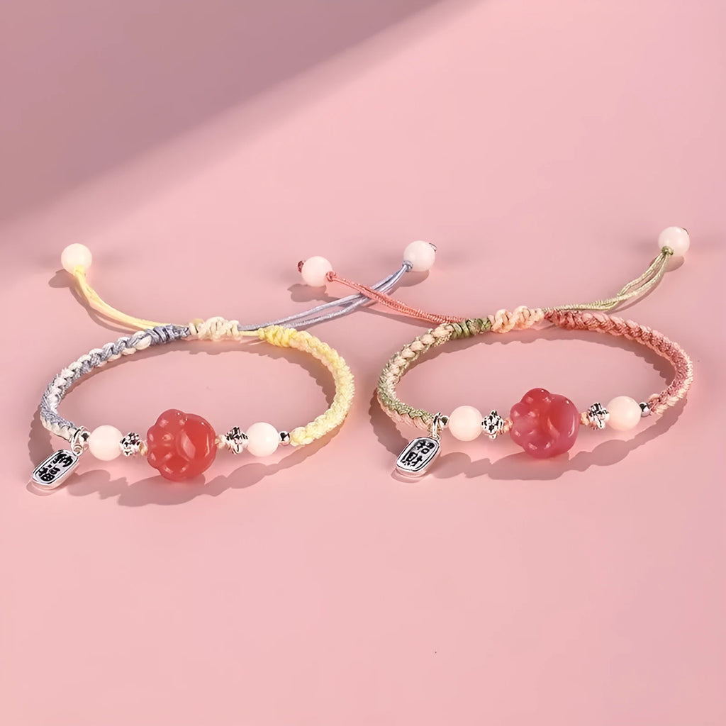 Red glass cat's paw charm bracelet with woven cord in pink or yellow for couples