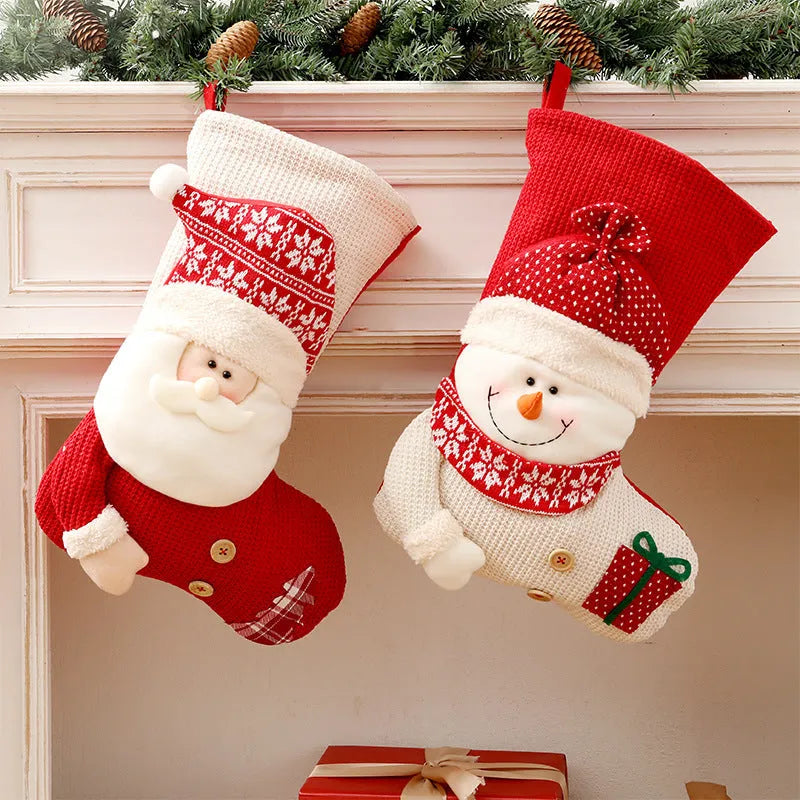 Large red and white knitted Christmas stocking with Santa Claus design hanging on fireplace