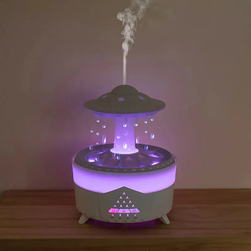 White UFO-shaped humidifier with water droplets creating mist and rain sounds