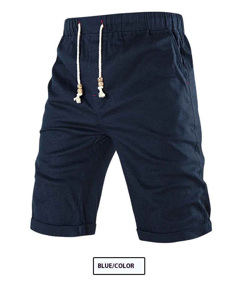 Men's solid colour cotton blend shorts with a drawstring waist and zipper pocket, shown in straight fit.